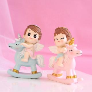 Trang trí em bé cưỡi kì lân xanh