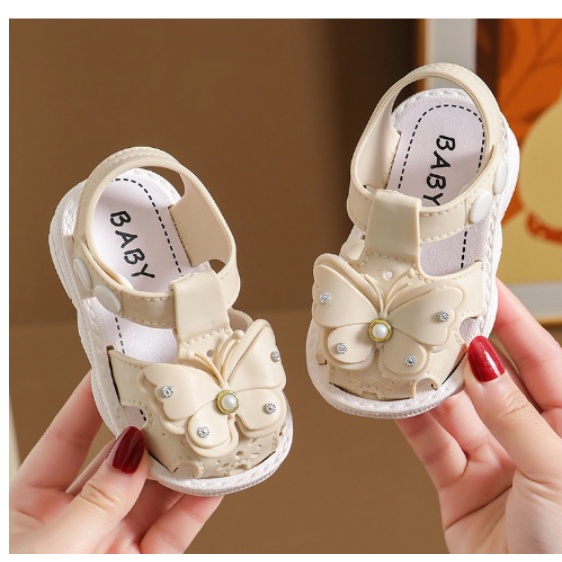 GIÀY SANDAL TẬP ĐI HÌNH NƠ VÀ HOA CÚC BẤM CHO BÉ
