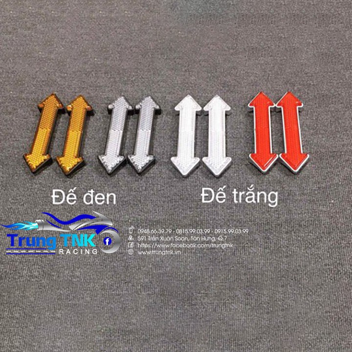 Mắt mèo phản quang mũi tên dán phuộc.