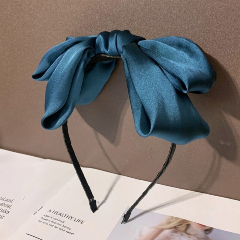 Cài tóc đính nơ thời trang xinh xắn cho nữ