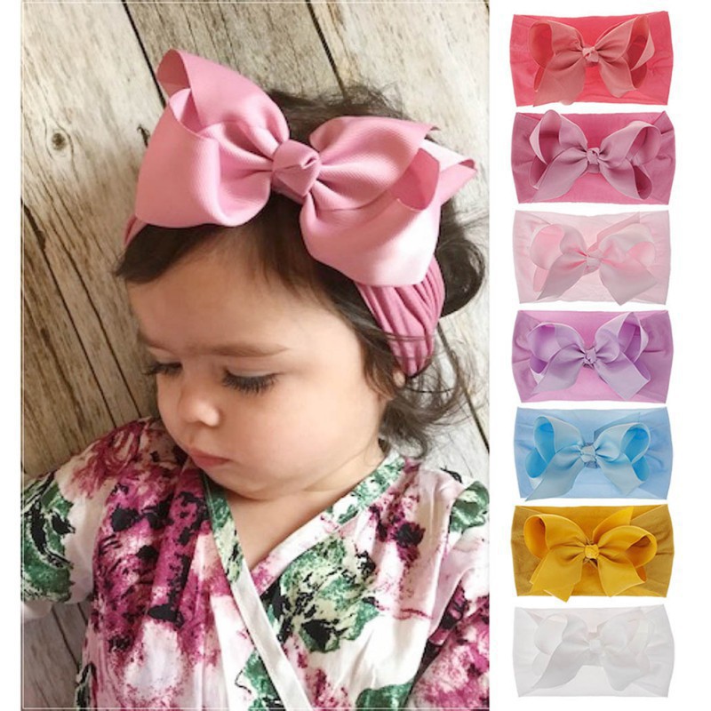 Dây buộc tóc co giãn đính nơ đáng yêu cho bé gái