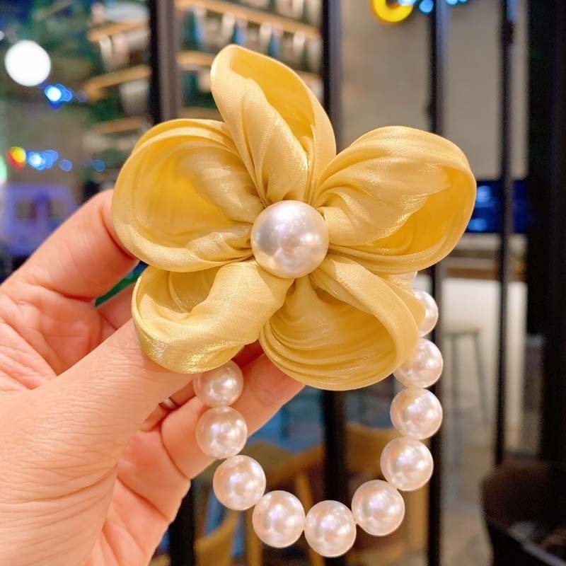 Dây buộc tóc WE FLOWER chất liệu cao su co giãn đính hạt ngọc trai và hoa đáng yêu cho nữ