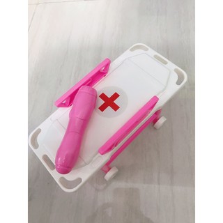 Giường bác sĩ và đèn pin
