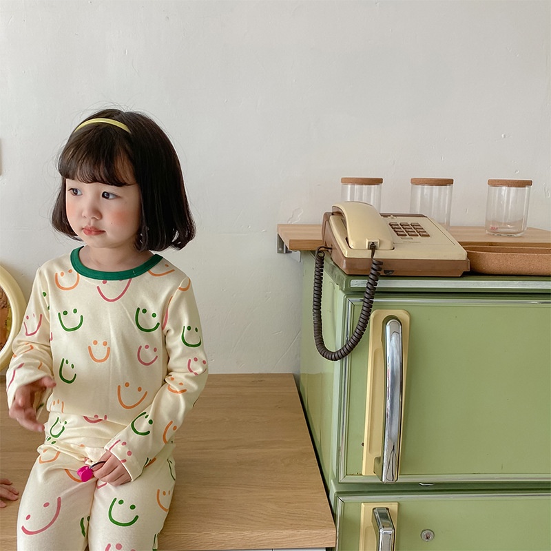 Bộ áo thun tay dài và quần dài in hình mặt cười cho trẻ sơ sinh