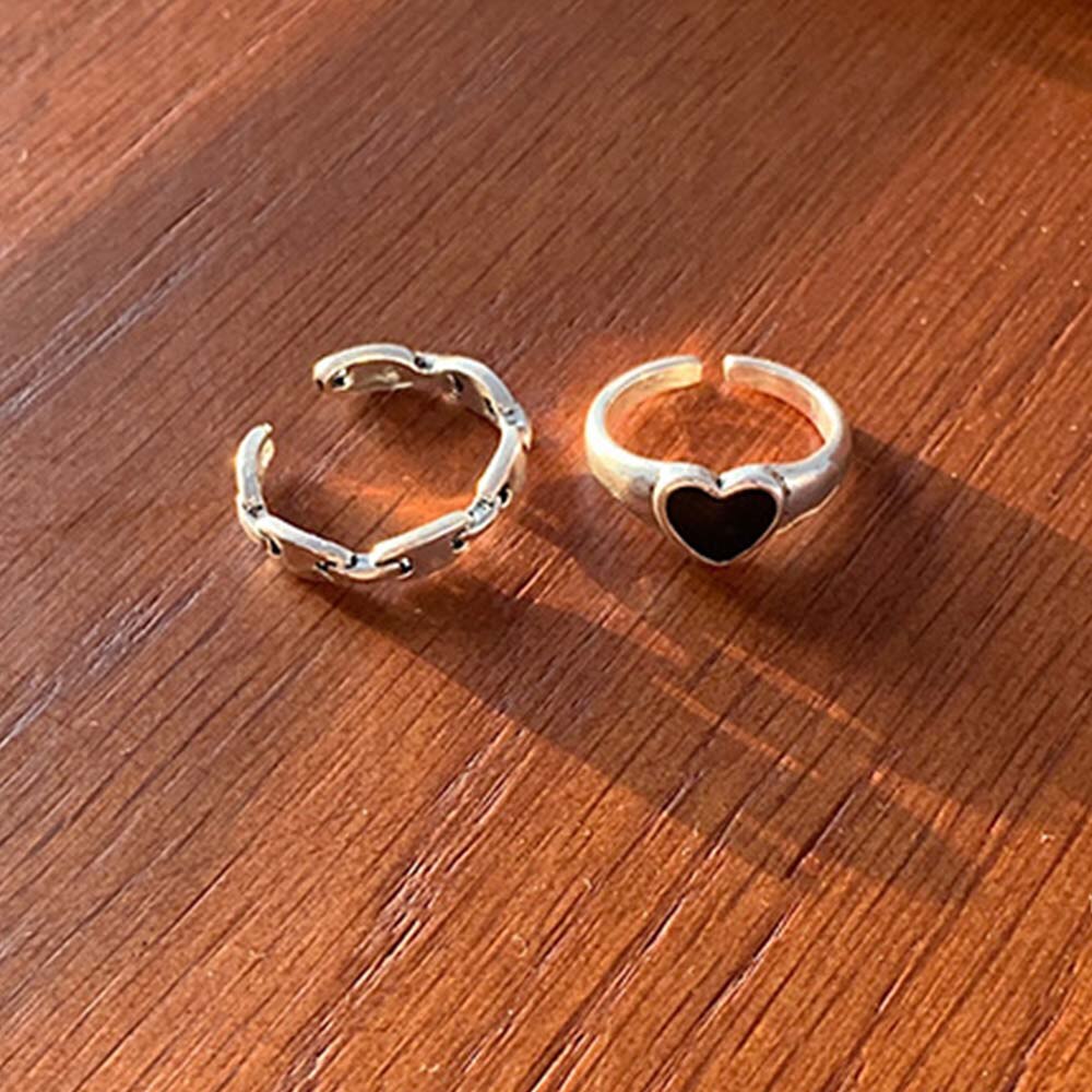 Set 2 nhẫn hở màu bạc/đen hình trái tim phong cách Punk đơn giản thời trang cho nữ