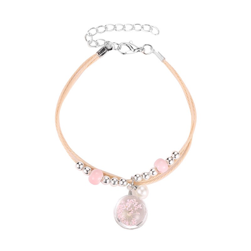 The aqua sphere shaped accessory bracelet contains lovely Korean style dried flowers