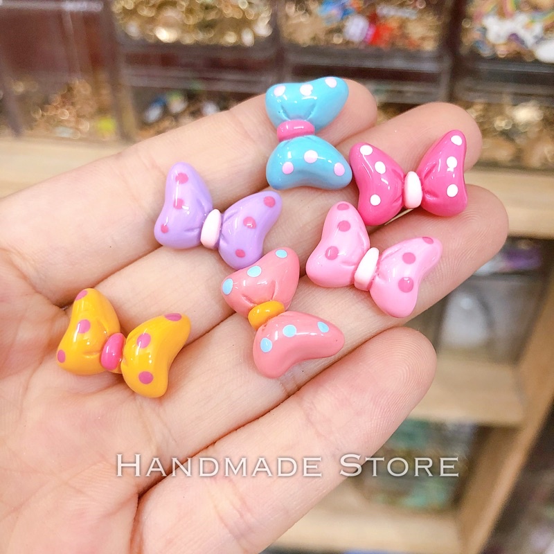 Charm nơ chấm bi