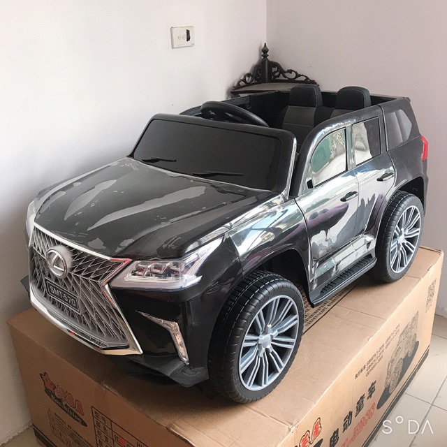 Xe điện LX 570 cho bé bản 4 động cơ , sơn thường có nhún.