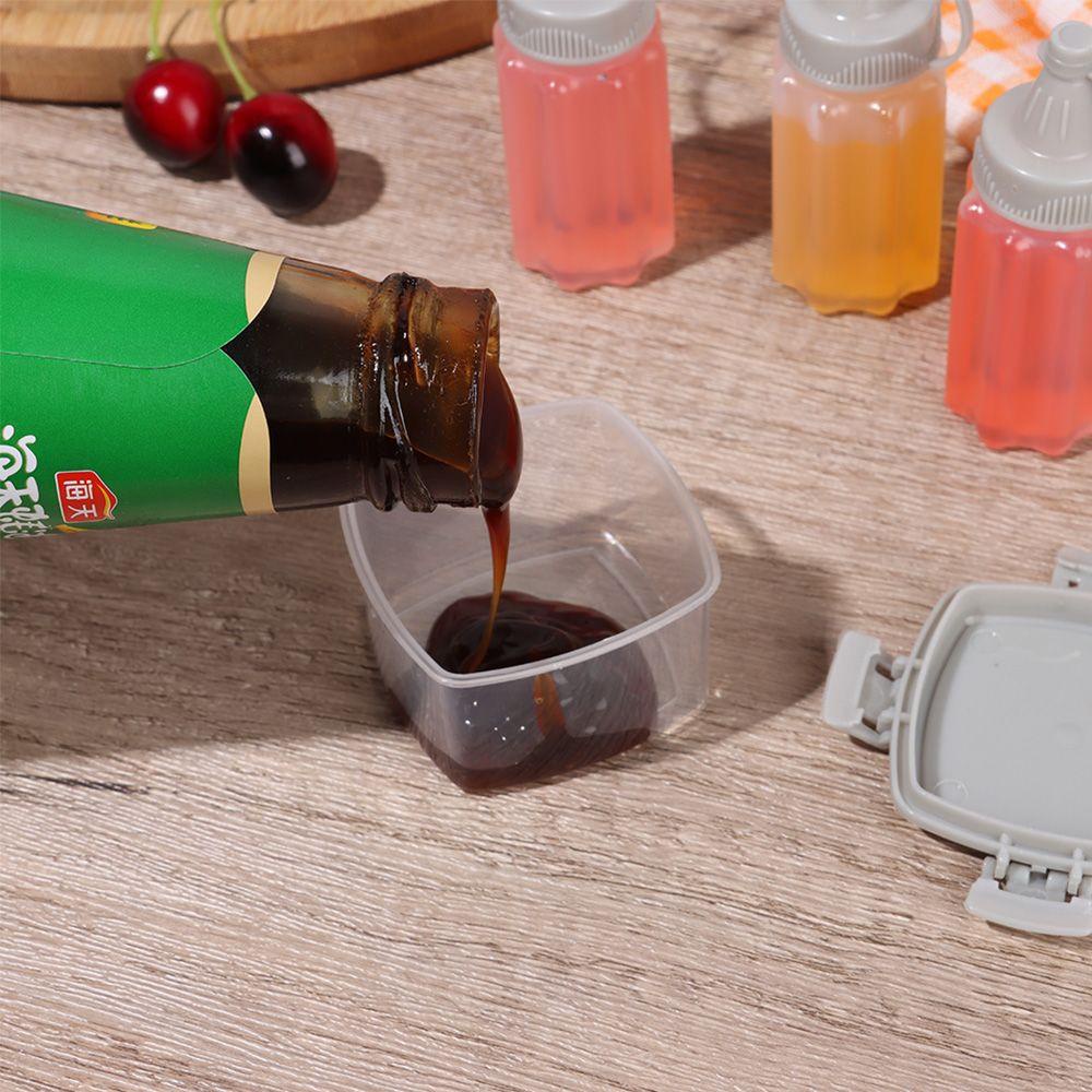 Bộ 4 Lọ Đựng Gia Vị Mini Dạng Bóp Màu Trong Suốt Dễ Lau Chùi Cho Nhà Bếp