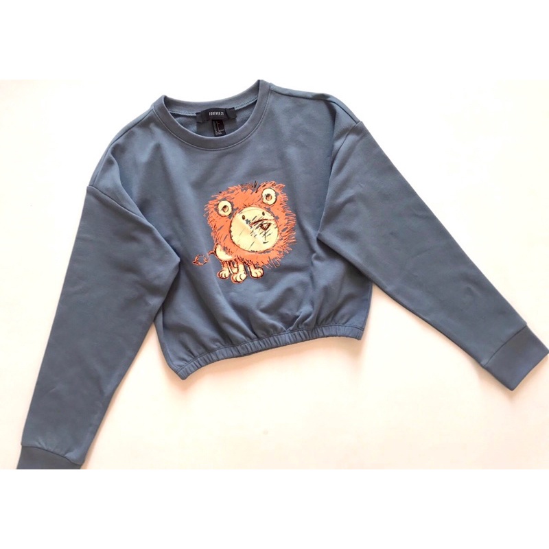 Áo nỉ da cá dài tay bo thun in sư tử vnxk