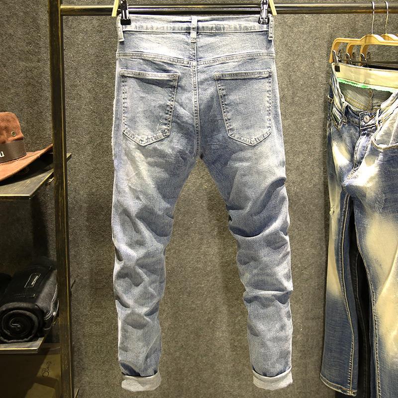 Quần jean dài giặt kỹ in logo co giãn màu sáng thời trang cá tính nổi bật cho nam