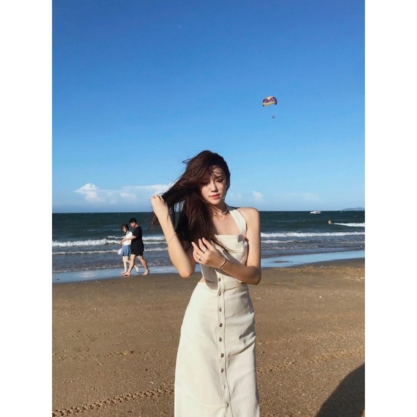 Đầm yến midi kem xẻ đùi nút lệch cut-out lưng