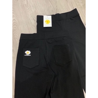 Quần legging in hoa cúc vàng