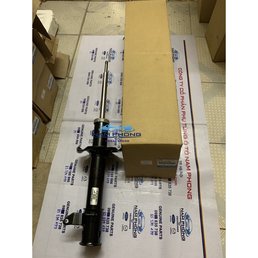 Giảm sóc sau Laser Mazda 323 Premasi bên lái LH - BVJE28900 / BL5P28900 / BK2J28900E / BK2J28900G