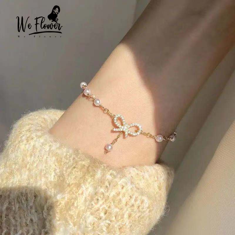 Vòng tay WE FLOWER mạ vàng 14K xỏ hạt ngọc trai mặt nơ dễ thương cho nữ