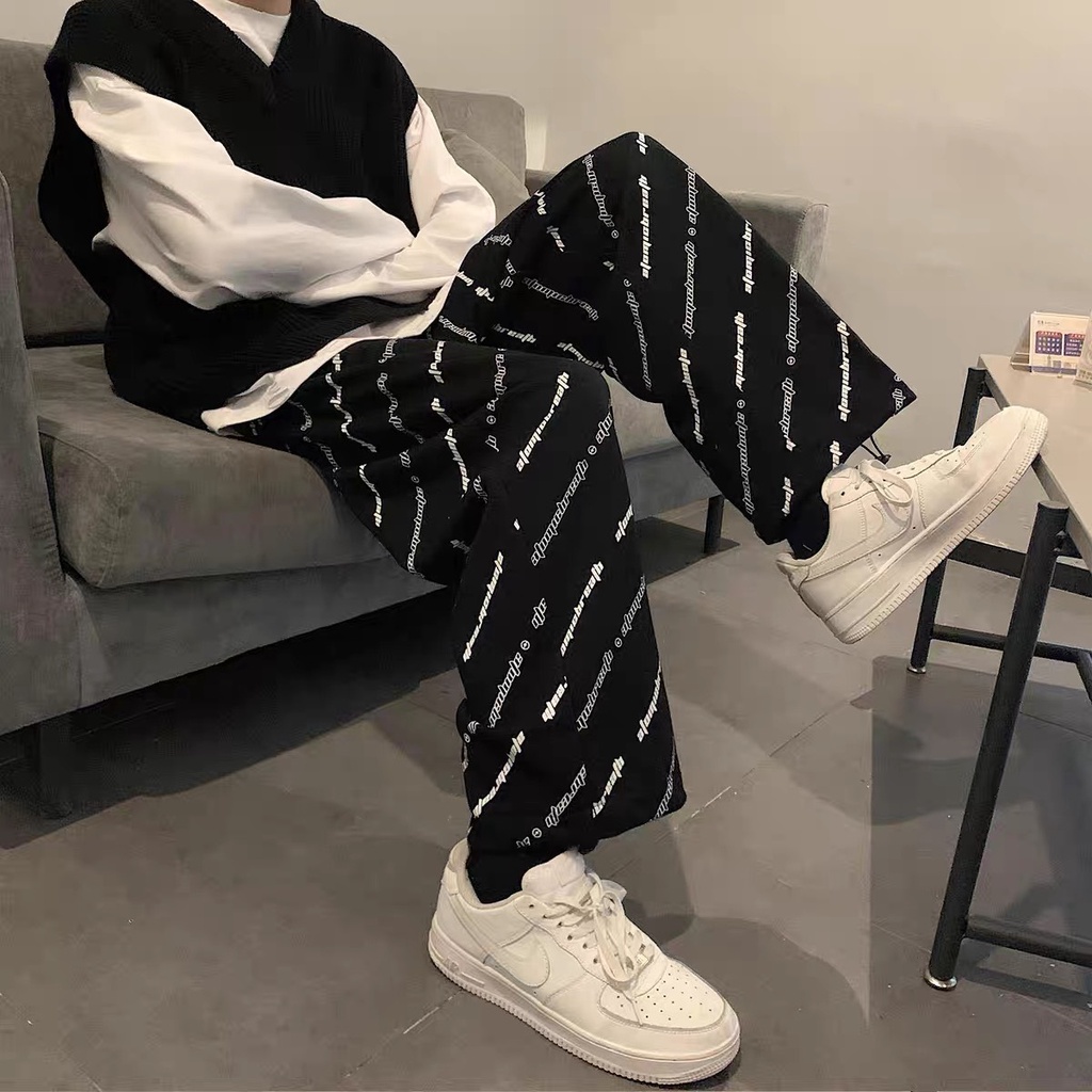Quần jogger chữ chéo Nhật Minh chất nỉ ngoại hàng dầy nặng tay, có chốt gấu điều chỉnh, from ống rộng