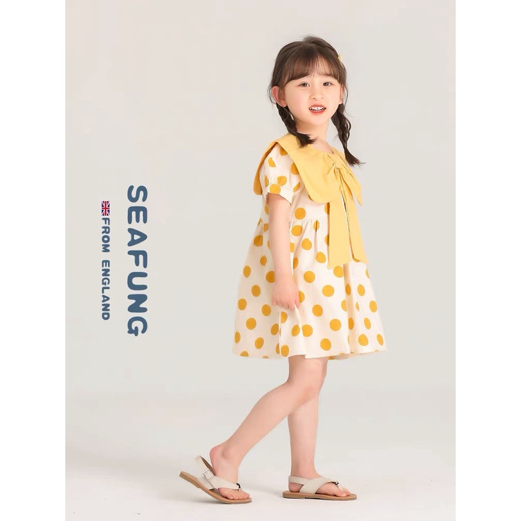 Váy chấm bi vàng cổ nơ cho bé gái chất đũi mềm mát và thấm mồ hôi