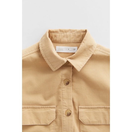 Áo Sơ Mi Bé Gái Dáng Dài Nhung Tăm Overshirt Nâu Be ZR