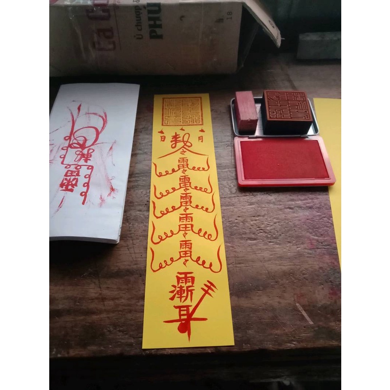 100 tờ Giấy hoàng chỉ vàng in vẽ phù kt 7x27cm