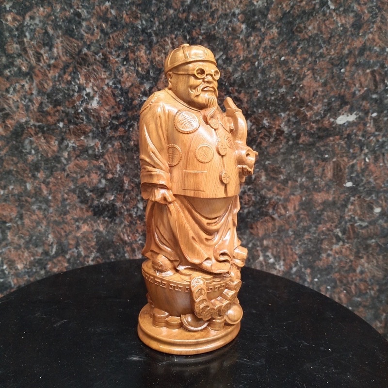 tượng ông quản gia gỗ bach xanh