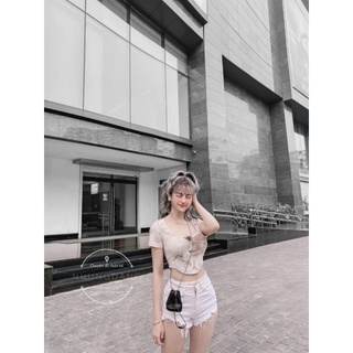 Áo kiểu loang nút bấm vạt bầu