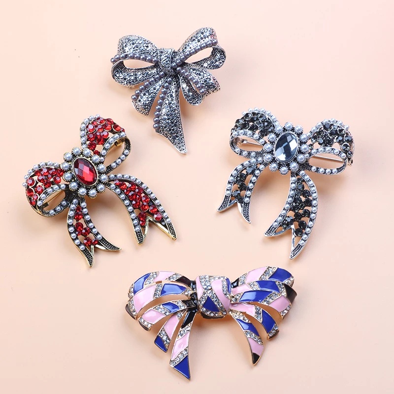 Ghim Cài Áo Hình Nơ Đính Đá Và Ngọc Trai Thiết Kế Sang Trọng