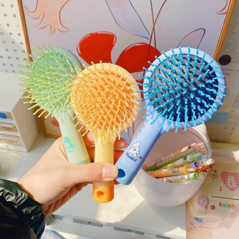 Gương tròn có tay cầm kèm lược mát xa,gỡ rối tóc