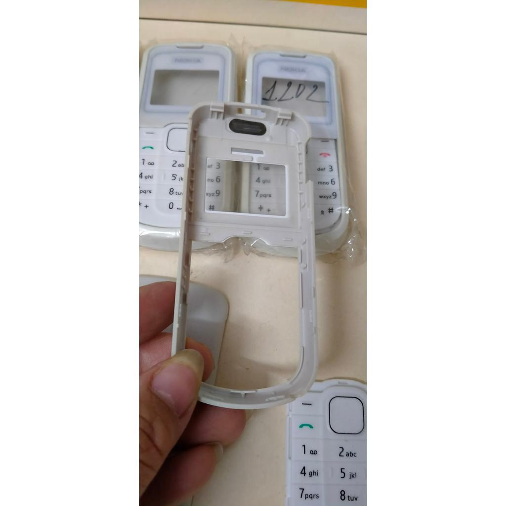 Vỏ Nokia 1202 có phím và không có khung sườn, mặt có màu trắng và màu đen, giá tốt nhất