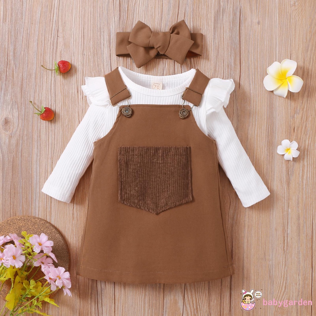 Bộ áo cổ tròn tay dài kiểu nhún bèo có nút gài phía dưới + váy yếm có túi phía trước + băng đô dành cho bé gái