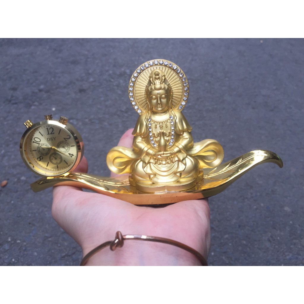 Tượng phật bà kèm đồng hồ trang trí taplo xe hơi .