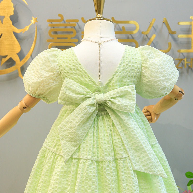 Váy bé gái xanh cốm 2 tầng nơ lưng XHN1016