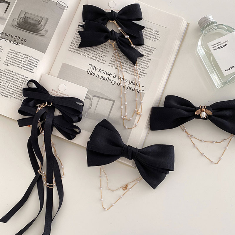 Kẹp tóc hình nơ đính ngọc trai nữ tính thời trang