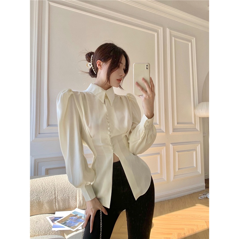 Áo sơ mi nữ tay dài phồng màu kem trắng cổ polo đính nút xẻ tà ulzzang thắt dây nơ sau lưng