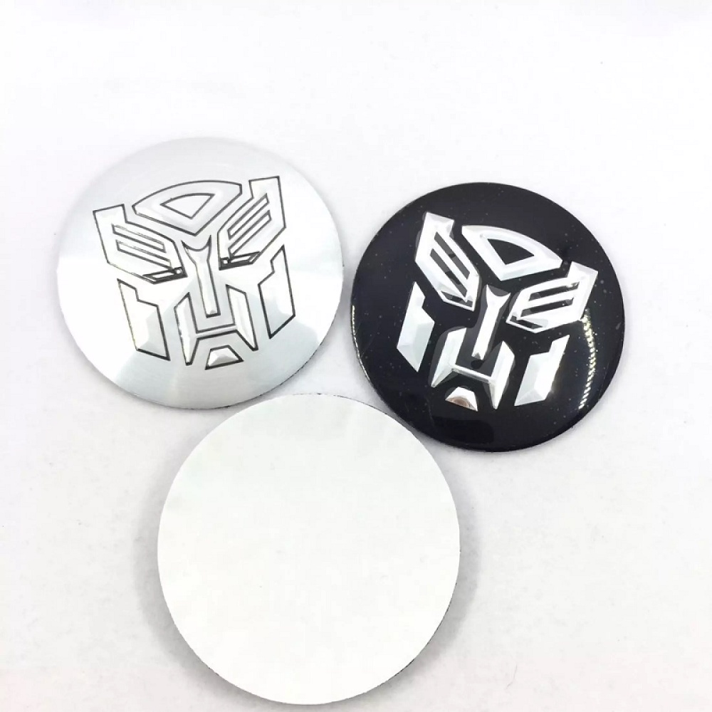 Bộ 4 Logo Nhôm Dán Trục Bánh Xe Hơi Hình Transformers