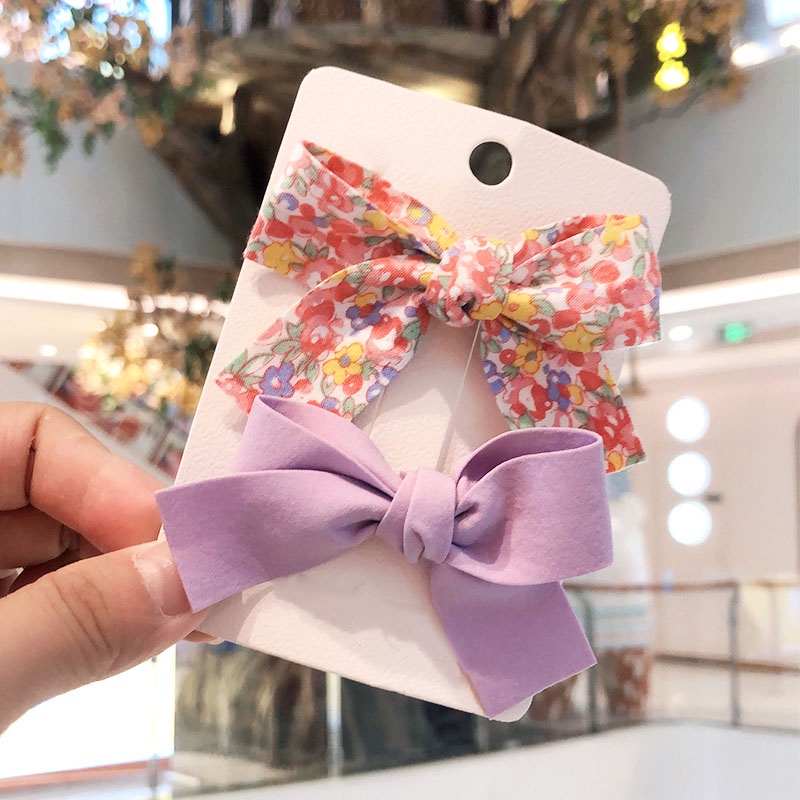 Set 2 Kẹp Tóc Nơ Hoa Màu Trơn Nhỏ Xinh Điệu Đà Cho Nữ