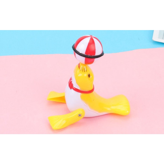 Đồ chơi vặn cót hải cẩu xoay bóng vặn cót 6.7*6.5cm DUASHOP.