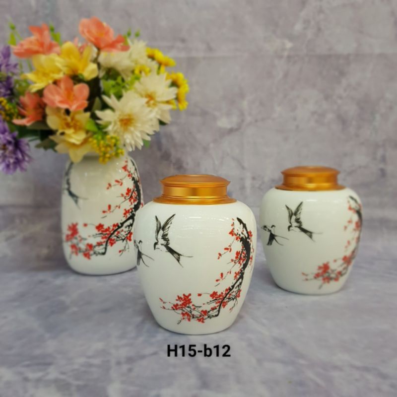 Hộp chè - Hộp đựng chè vẽ chim bay trên cành đào xuân - Nắp hộp sang trọng.