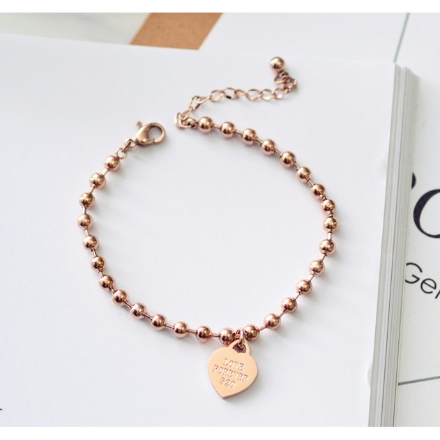 Lắc tay - lắc chân titan bi tròn phối mặt trái tim không gỉ