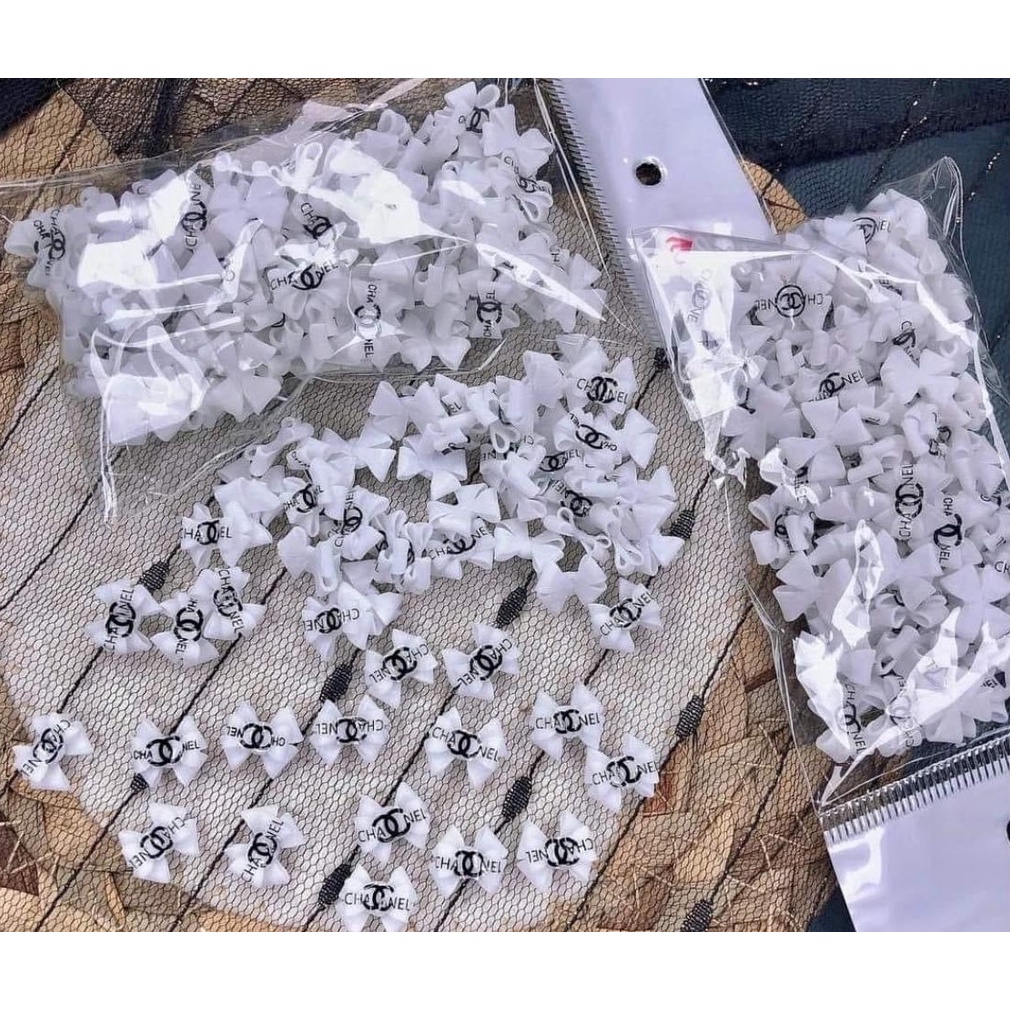 nơ bột đính móng tay trắng  - đen ( giá 1 cái)