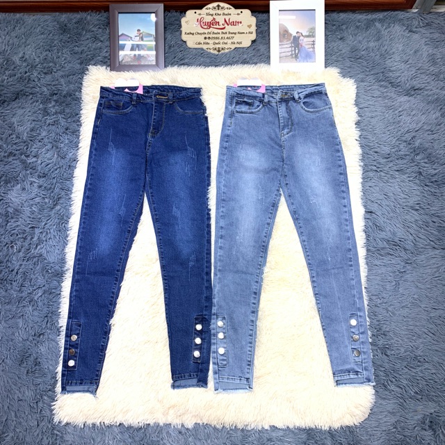 quần jean lệch gấu đính khuy chân | BigBuy360 - bigbuy360.vn