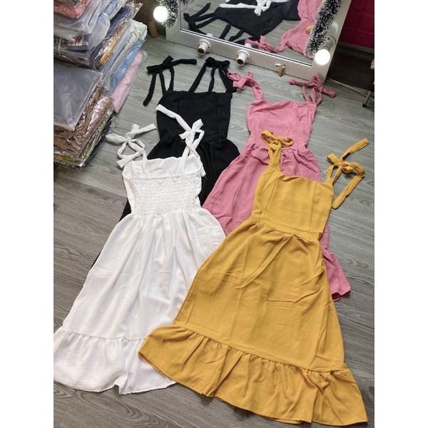 Đầm 2 dây cột nơ vải đũi cao cấp chất mịn và mát.