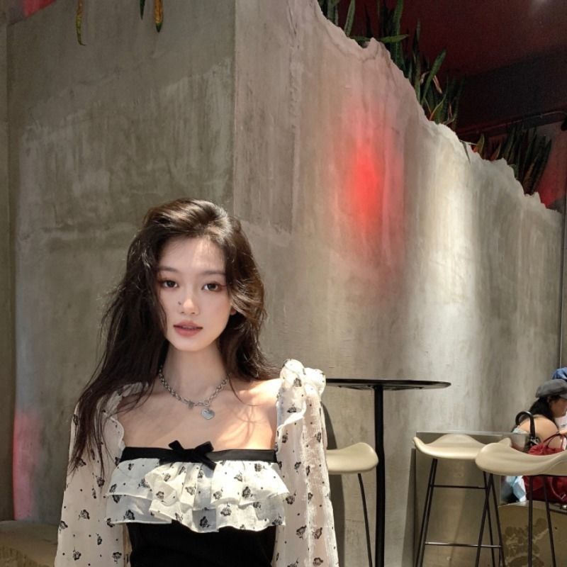 Đầm đen tay dài phối bèo nhún đính nơ phong cách Pháp thời trang mùa thu mới 2021