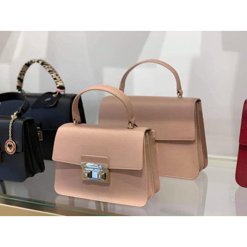 Miếng dán khoá túi Fl top b.e.l.l.a