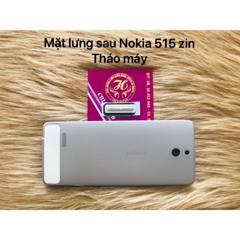 Mặt lưng sau Nokia 515 zin tháo máy bao gồm nút âm lượng