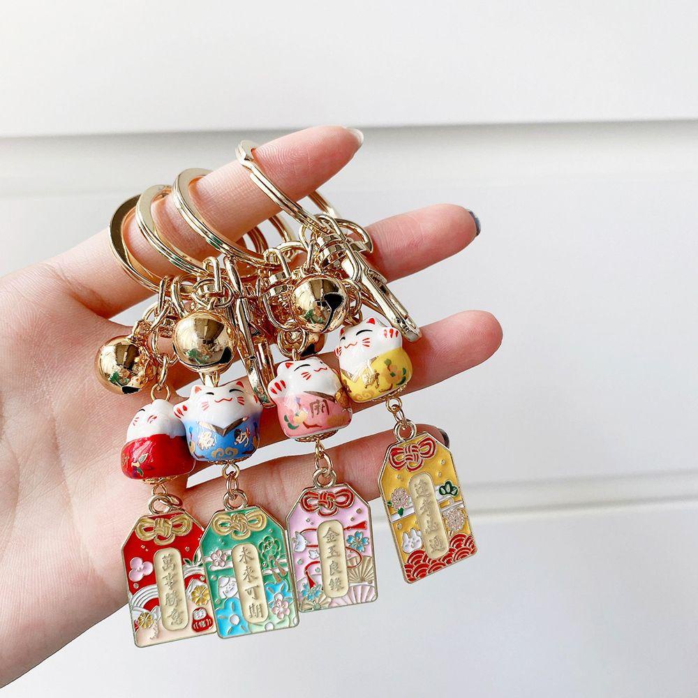 Móc Khóa Hình Chú Mèo May Mắn Bằng Gốm Kèm Chuông Maneki Neko Dễ Thương