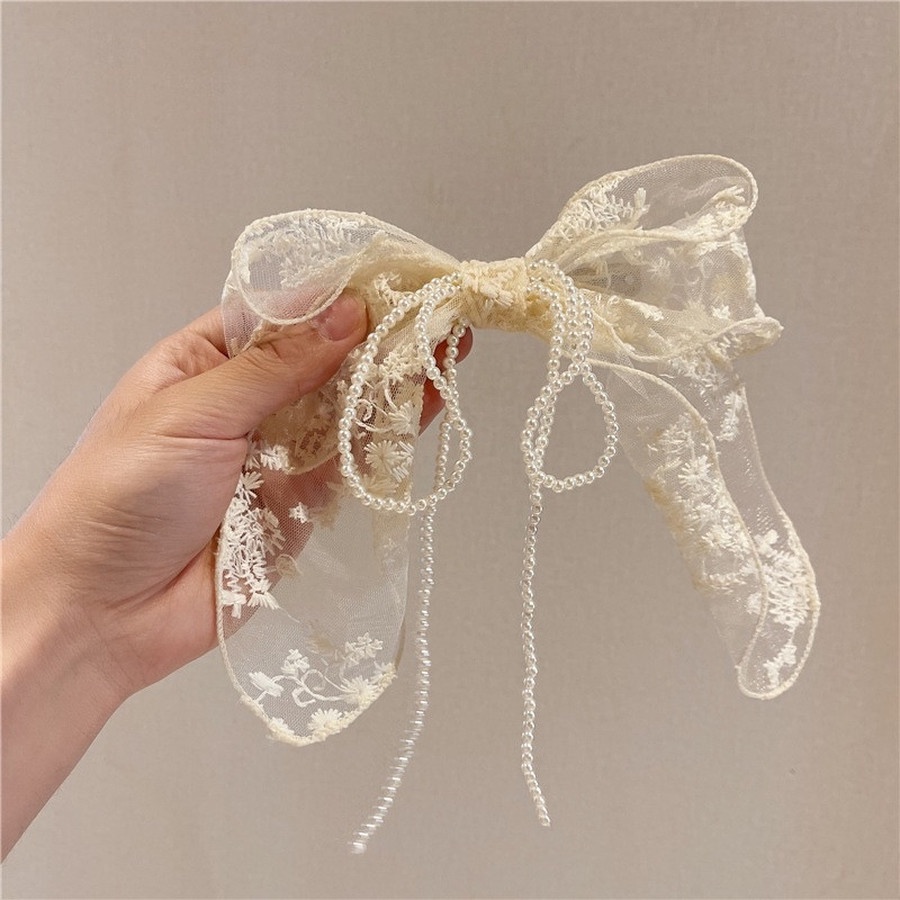 Kẹp tóc đính ngọc trai nhân tạo hình nơ hợp thời trang cho nữ