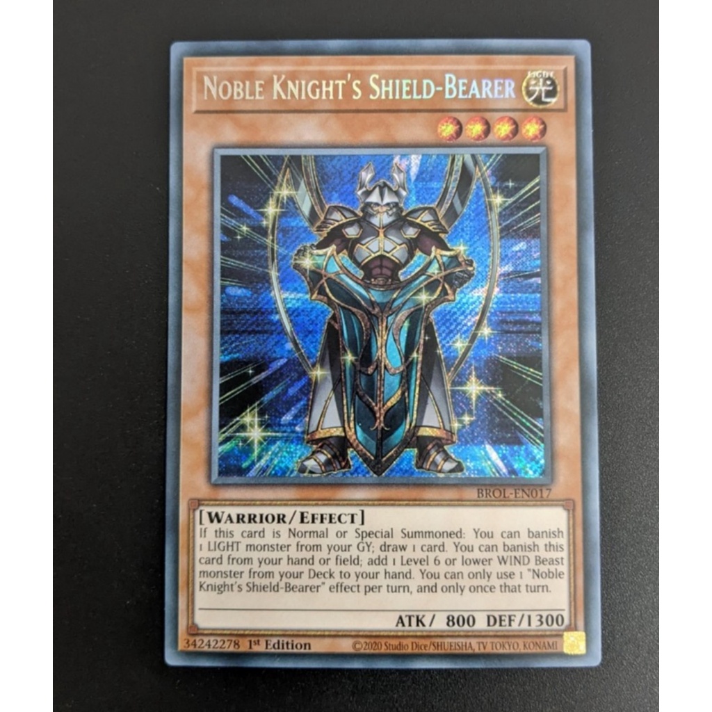 Lá bài Noble Knight's Shield-Bearer - BROL-EN017 - Secret Rare 1st Edition