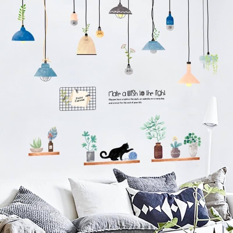 Decal dán tường tường đèn và mèo trên kệ cây.