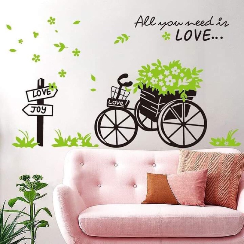 Decal dán tường xe đạp xanh và chậu cây trên kệ