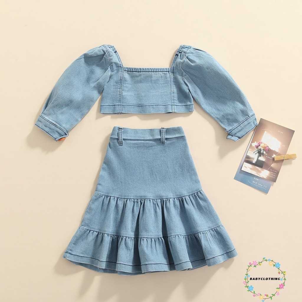 Set trang phục 2 món gồm áo croptop tay phồng cài nút + chân váy jean cho bé gái đi dạo